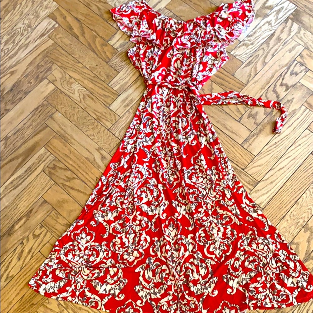 Sleeveless red dress with cream/brown/blk swirls.